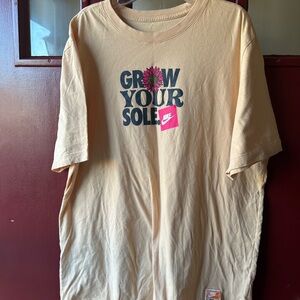 Nike Cream Short Sleeve Tee with Floral 'Grow Your Sole' Graphic
